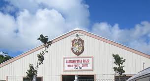 Sonell Joubert, a 45-year-old woman, appears in Tonga Magistrate’s Court for the murder of Jurgen Nel, found dead with multiple stab wounds at Lowhills Farm. Joubert faces charges, and the investigation continues.