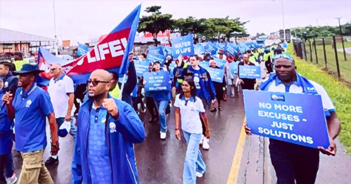 KwaDukuza residents protest against 13.5 percent water tariff hike with signs and banners demanding service delivery
